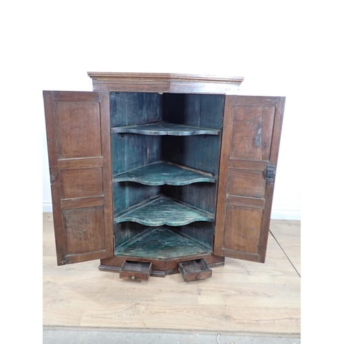 514 - A 19th Century oak hanging Corner Cupboard 3ft 9in H x 2ft 8in W