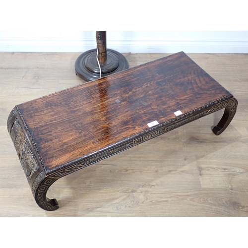 57 - A carved Chinese hardwood Coffee Table 3ft 4in W x 1ft H and a Chinese carved Standard Lamp with sha... 