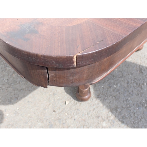 629 - A 19th Century mahogany Breakfast Table with oblong top on square column and concave platform base, ... 