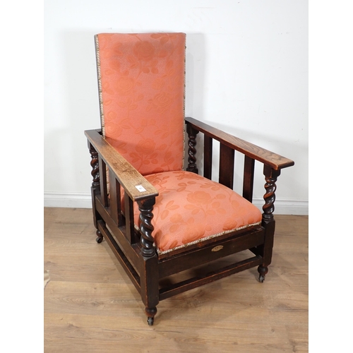 63 - A 'Futurist' oak framed pink upholstered reclining Chair