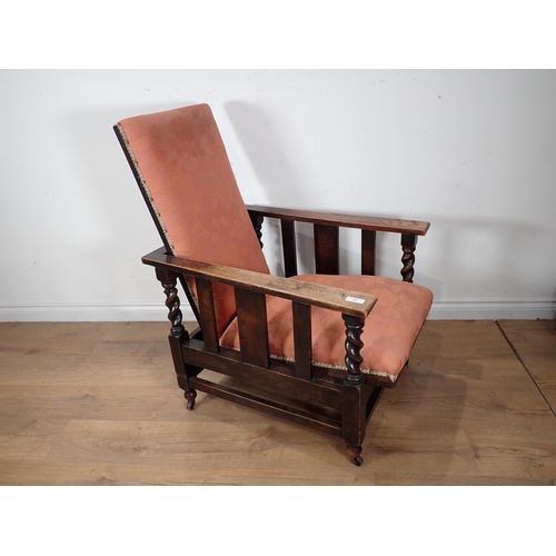 63 - A 'Futurist' oak framed pink upholstered reclining Chair