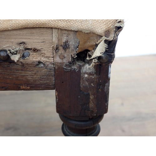 636 - An 18th Century oak Stool with upholstered top, A/F, on turned square supports, united by square str... 