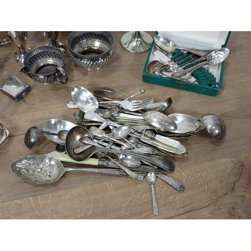 64 - A box of plated ware including Tankards, Cutlery, Toast Rack, etc.