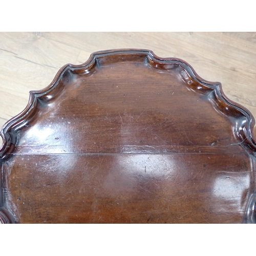 66 - A George III mahogany Wine Table with dished pie crust top on tripod base 1ft 8in D x 1ft 2in H and ... 