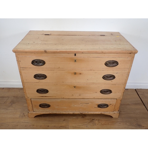 7 - A pine Blanket Chest with hinged cover above three dummy drawers and one real drawer on bracket supp... 