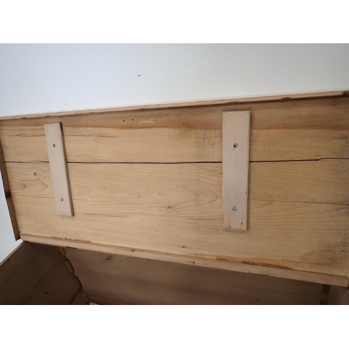 7 - A pine Blanket Chest with hinged cover above three dummy drawers and one real drawer on bracket supp... 