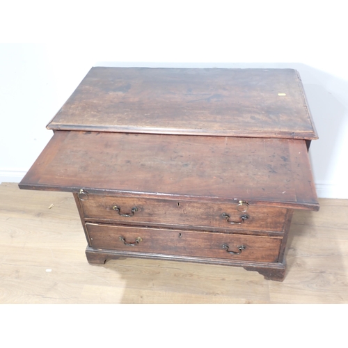 76 - A George III mahogany batchelor's Chest with brushing slide over four graduated drawers mounted upon... 