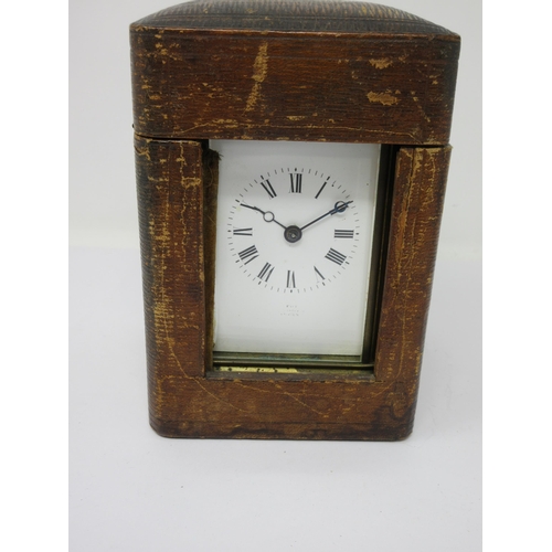 81 - A brass cased Carriage Clock with lever escapement, hour repeater, 6½in, in original case, with key