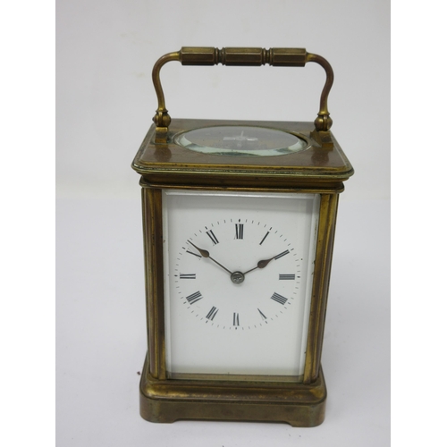 96 - A brass cased Carriage Clock with white enamel dial, lever escapement, 6½in, in case