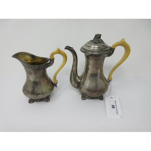 98 - An Austrian silver Coffee Pot and Milk Jug on scroll feet, ivory scroll handles