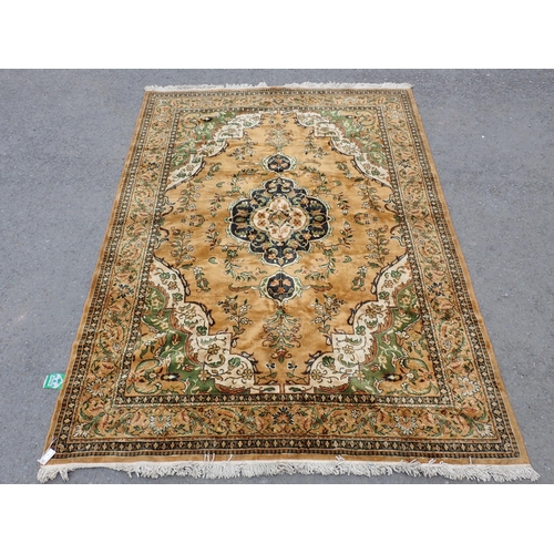 9 - A Burlap Rug with central medallion, floral designs on a brown ground, 10ft 2in x 7ft 2in