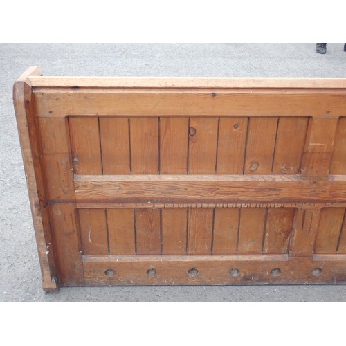 366 - A long Victorian pine Pew 12ft 5in L x 2ft 10in H