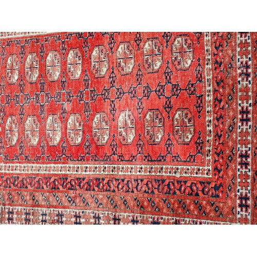 351 - A Persian red ground Rug with two rows of medallions within multiple borders 6ft L x 4ft 4in W and a... 