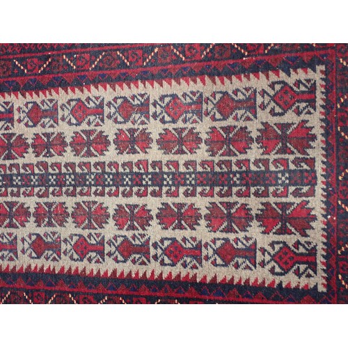 351 - A Persian red ground Rug with two rows of medallions within multiple borders 6ft L x 4ft 4in W and a... 