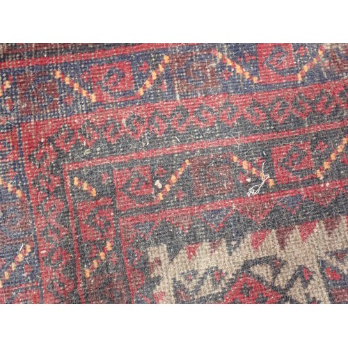 351 - A Persian red ground Rug with two rows of medallions within multiple borders 6ft L x 4ft 4in W and a... 