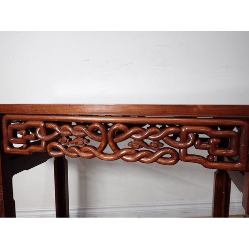 1 - A Chinese hardwood Serving Table with carved and pierced frieze, the squared supports with surface c... 