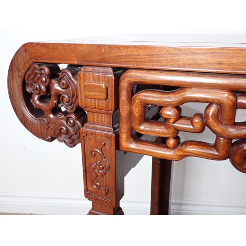 1 - A Chinese hardwood Serving Table with carved and pierced frieze, the squared supports with surface c... 