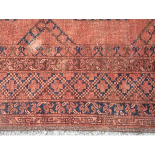 150 - A Persian Carpet with multiple borders, the central ground having three rows of medallions on a red ... 