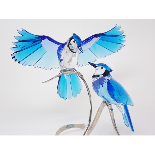 296 - A Swarovski crystal Sculpture of two birds on a metal stand, 12in H, boxed