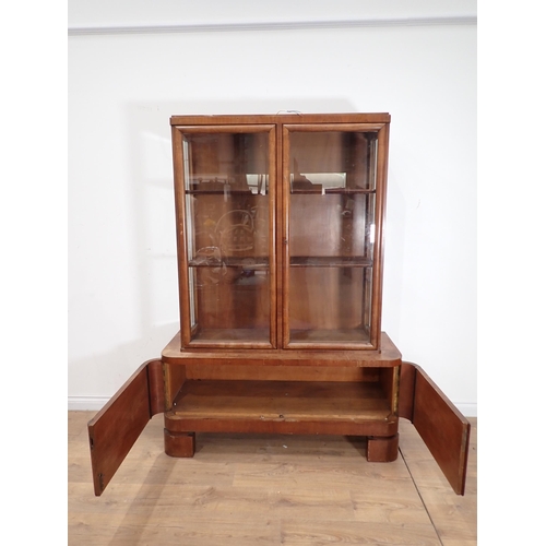 17 - A Biedermeier style walnut glazed Bookcase above base fitted pair of cupboard doors 5ft 8in H x 4ft ... 