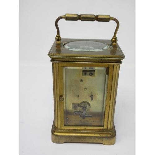 55 - A brass cased Carriage Clock with white enamel dial, lever escapement, 6½in, in case