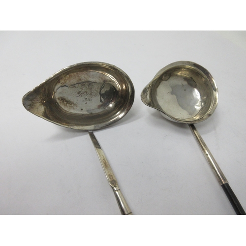 103 - Two Georgian Toddy Ladles with spiral whalebone handles, one engraved initials