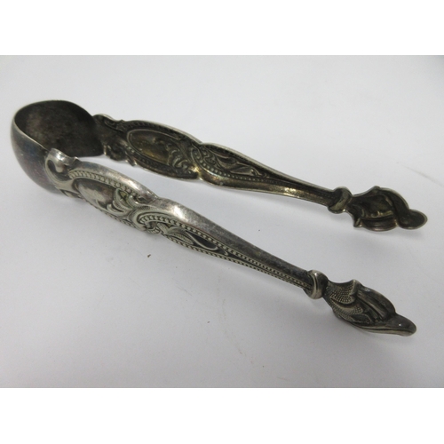 112 - Two pairs  of Austrian silver Tongs, leafage embossed, five other pairs of Tongs, and a Tea Infuser