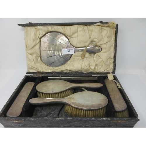 135 - A sterling silver mounted Hand Mirror, Brush and File, cased, a pair of silver mounted Brushes, Napk... 