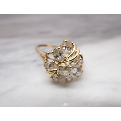 165 - A Cluster Dress Ring claw-set oval CZs in 14 ct gold, ring size U, lacks one stone, approx 5gms