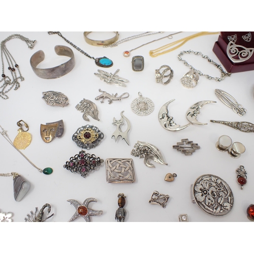 194 - A collection of silver and white metal Brooches, Bangles, Bracelets etc