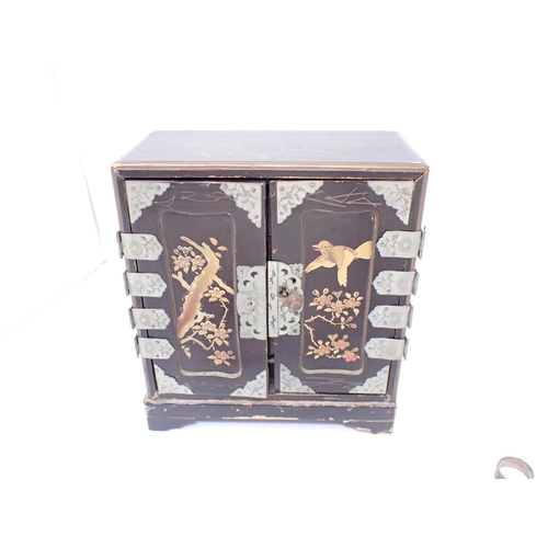 196 - A small lacquered Jewel Cabinet containing filigree and other brooches, charms etc