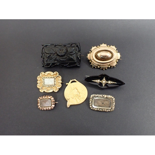 202 - A carved jet Brooch, two Lace Pins enclosing woven hair, a Mourning brooch and two others and a St H... 