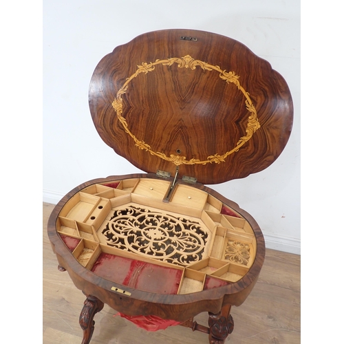 250A - A Victorian walnut Sewing Table with hinged oval top (warped) on carved cheval base, silk A/F