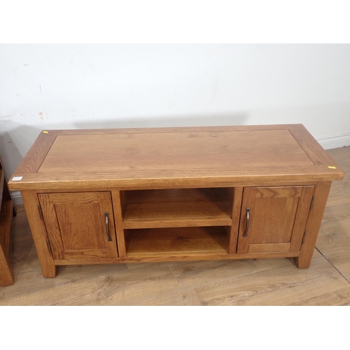 251 - A modern oak veneered Coffee Table, Nest of three Occasional Tables and a two door Cupboard