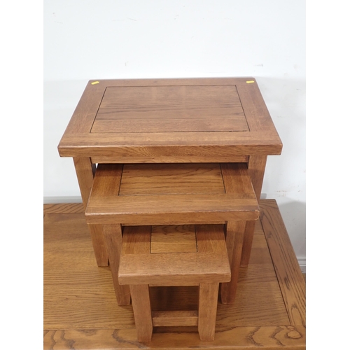 251 - A modern oak veneered Coffee Table, Nest of three Occasional Tables and a two door Cupboard