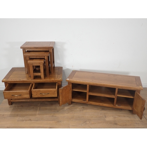 251 - A modern oak veneered Coffee Table, Nest of three Occasional Tables and a two door Cupboard