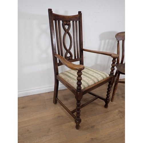 257 - An oak Elbow Chair and a Kitchen Chair