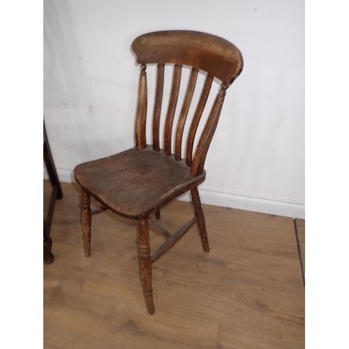 257 - An oak Elbow Chair and a Kitchen Chair