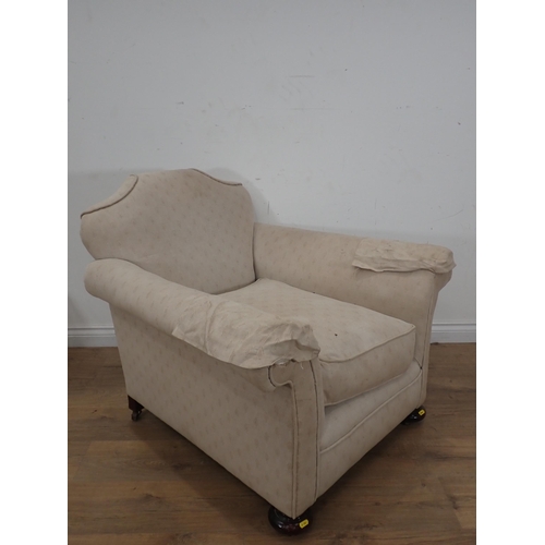 260 - An antique beige upholstered Armchair on bun feet 3ft 2in W x 2ft 7in H