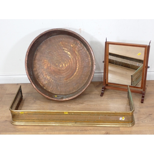 267 - An antique large copper Bowl, a pierced brass Fender and a mahogany Dressing Mirror