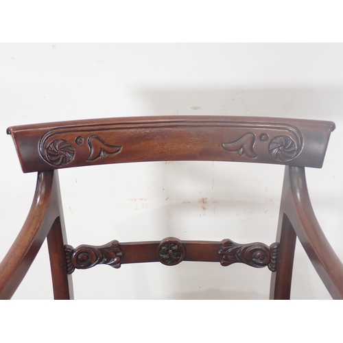 276 - A Regency mahogany bar-back Elbow Chair with scroll arms mounted on fluted tapering front supports