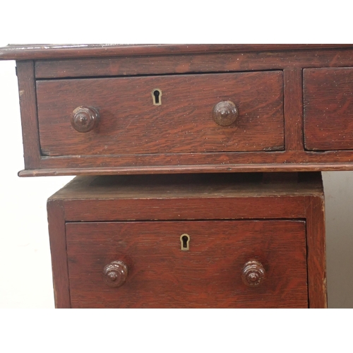 279 - A 19th Century mahogany pedestal Desk with green tooled leather inset writing surface above nine dra... 