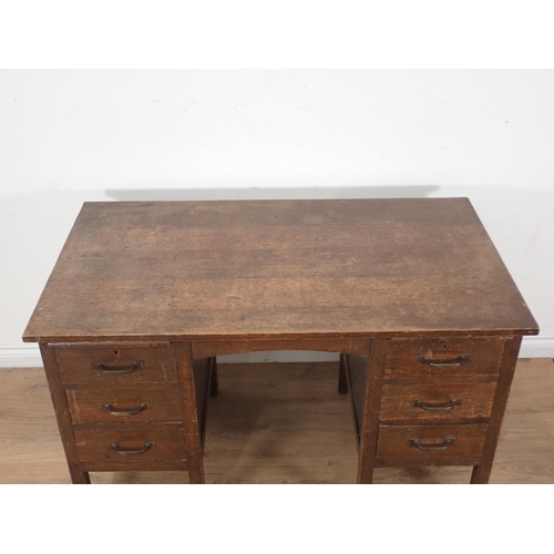 284 - An oak 'The Globe-Wernicke Co' kneehole Desk fitted six drawers 4ft W x 2ft 6in H x 2ft 3 in D