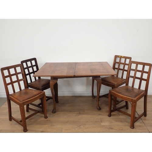 289 - An oak veneered fold over Dining Table and four Chairs