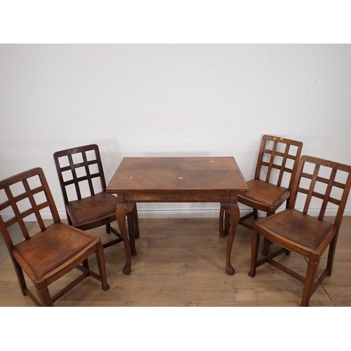 289 - An oak veneered fold over Dining Table and four Chairs