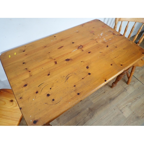 298 - A modern pine Kitchen Table and three Chairs