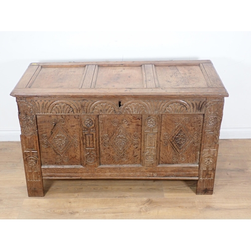 307 - A late 17th Century and later oak Coffer with sunken three panel lid and lozenge carved front (woodw... 