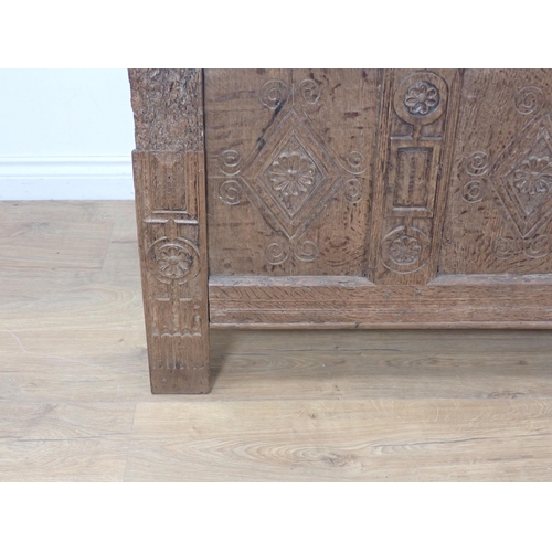 307 - A late 17th Century and later oak Coffer with sunken three panel lid and lozenge carved front (woodw... 