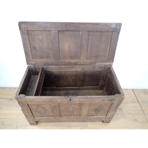 307 - A late 17th Century and later oak Coffer with sunken three panel lid and lozenge carved front (woodw... 