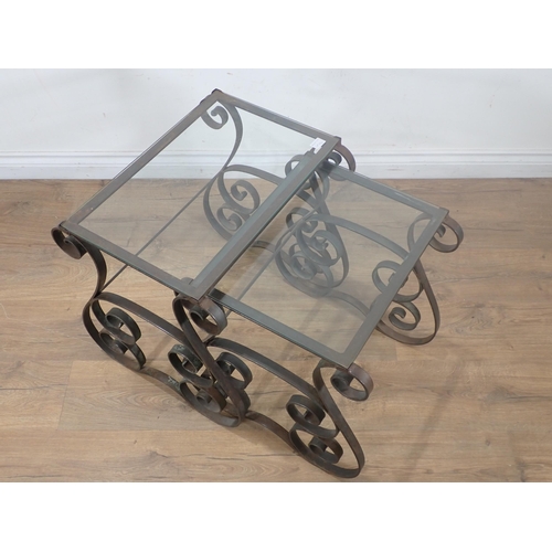 31 - A Nest of two wrought iron glass topped Occasional Tables